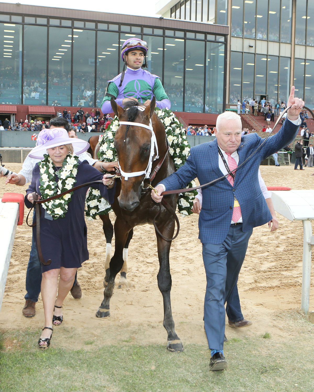 TO THE RACES
Prime Inc. owner Robert Low’s racehorse Magnum Moon wins the Arkansas Derby, qualifying him for the Kentucky Derby. Low, right, is pictured with his wife Lawana and jockey Luis Saez riding Magnum Moon.